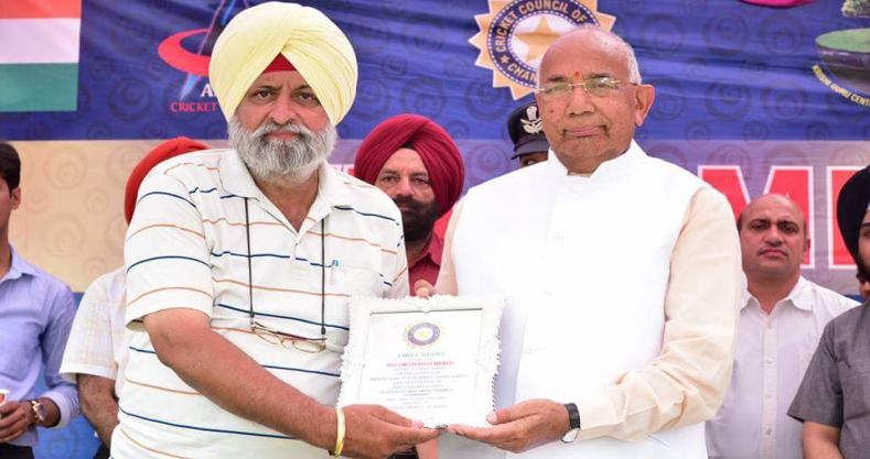 Chairman V.P. Singh Bedi receiving an award from the Governor of Punjab and Haryana