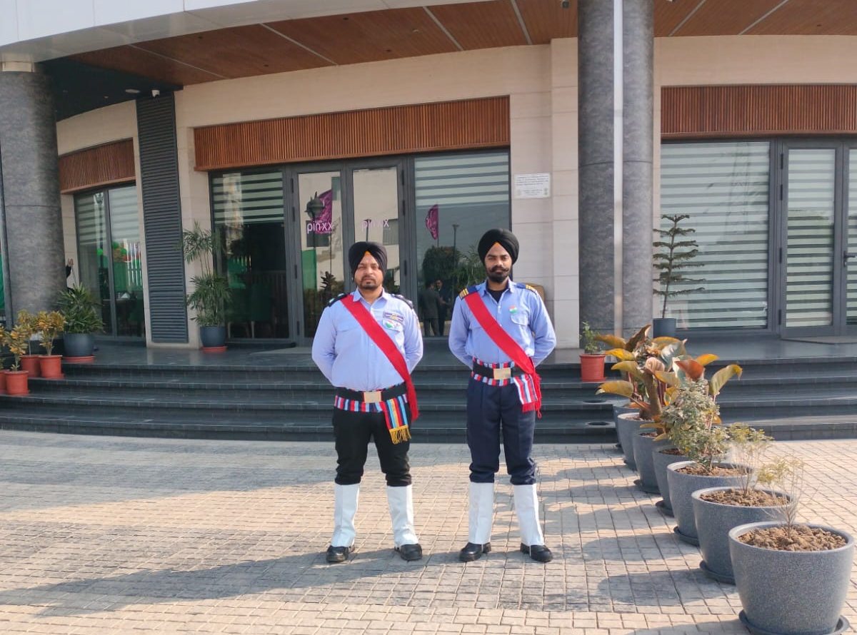 Two guards in ceremonial dress at a hotel entrance